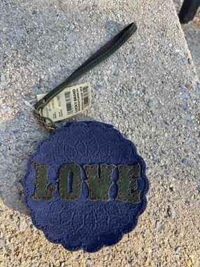 Lucky Brand purple Wristlet with Green Logo Patch